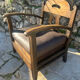 Pair of armchairs in stained wood and leather, 20th century