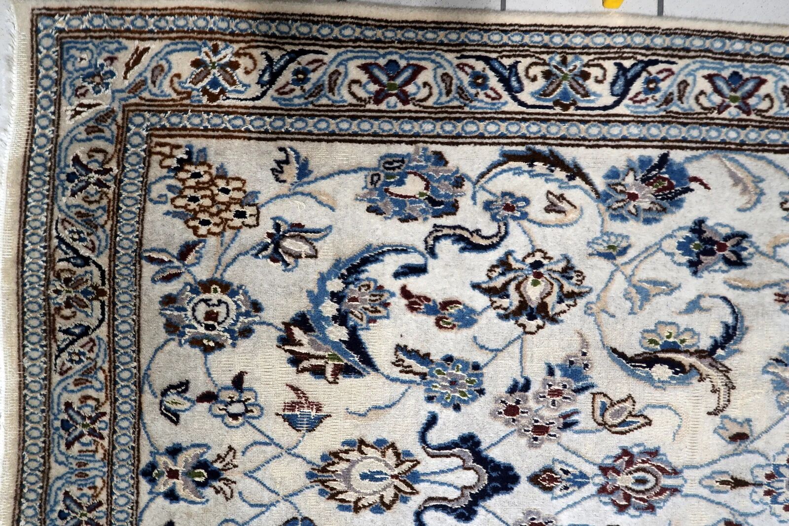 1950s hand-knotted wool rug with silk highlights, ivory and blue, 118 × 200 cm