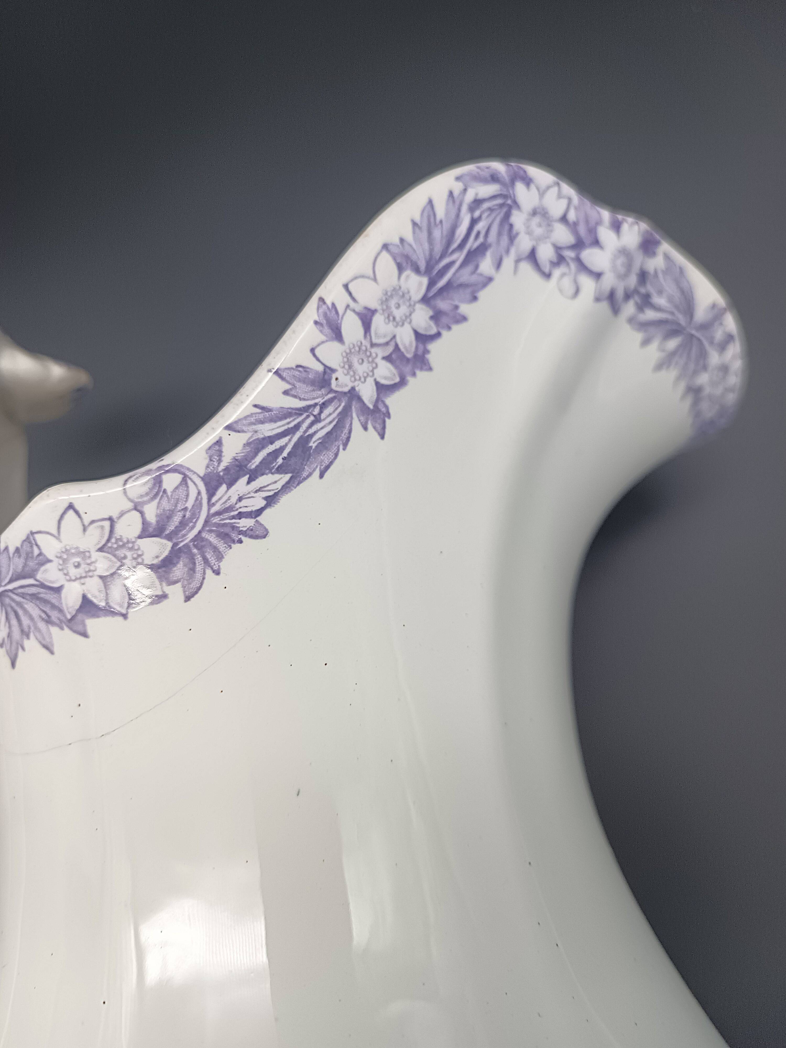 Large antique toilet bowl by Jules Vieillard Bordeaux with violet floral decoration.