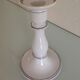Old white earthenware candlestick