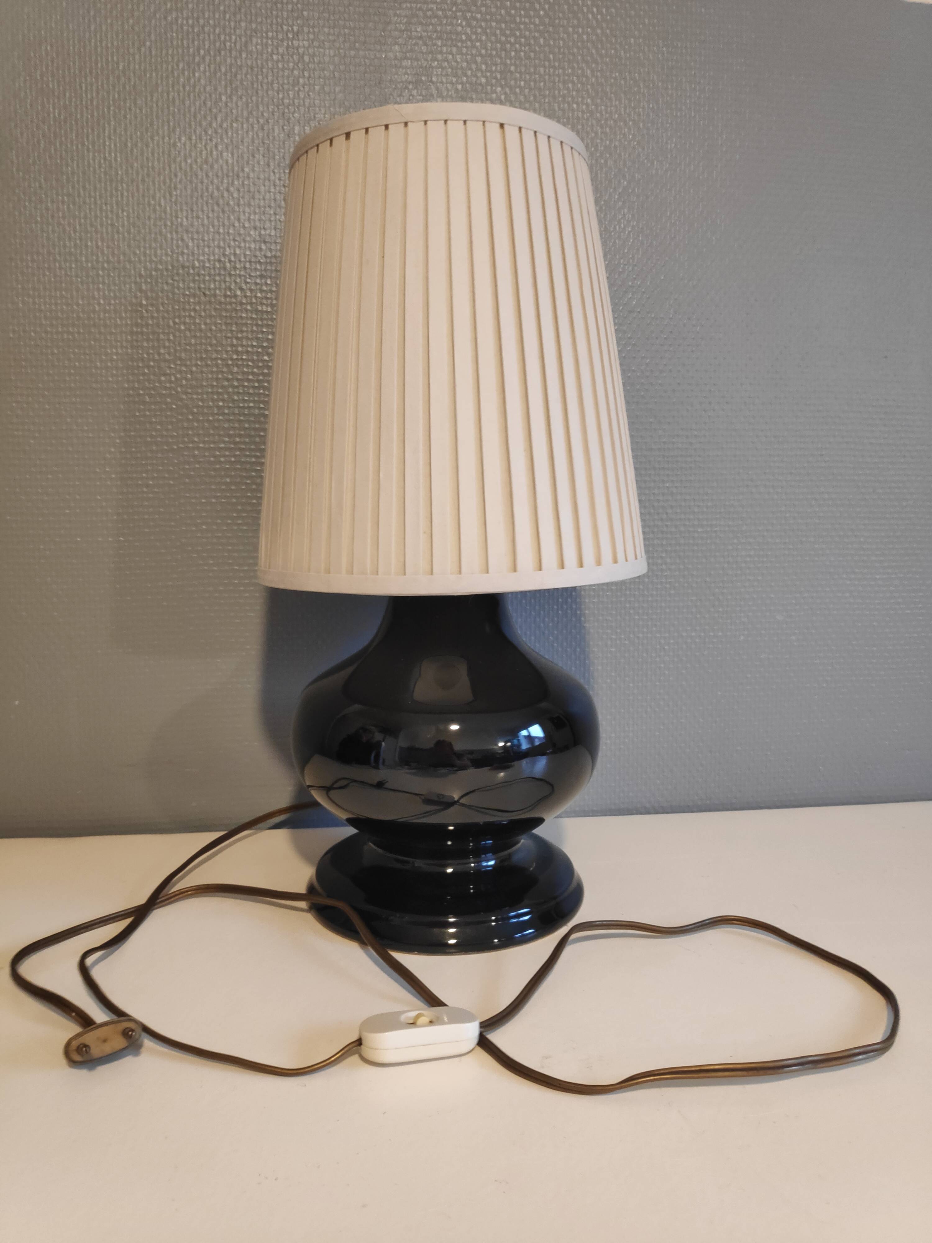 Black ceramic foot lamp and beige fabric lampshade