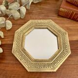 Golden oriental mirror