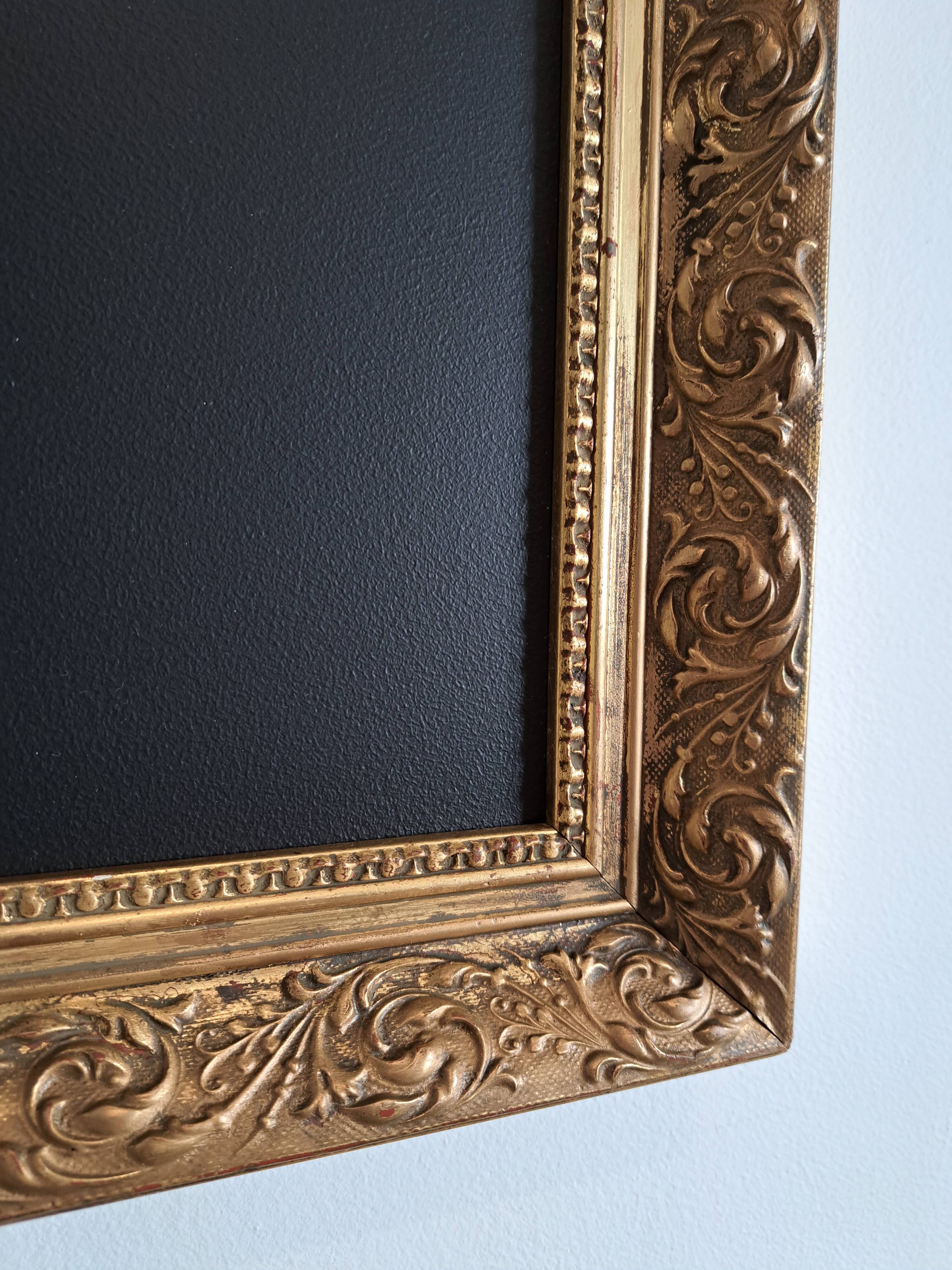 Slate table framed in gold leaf style