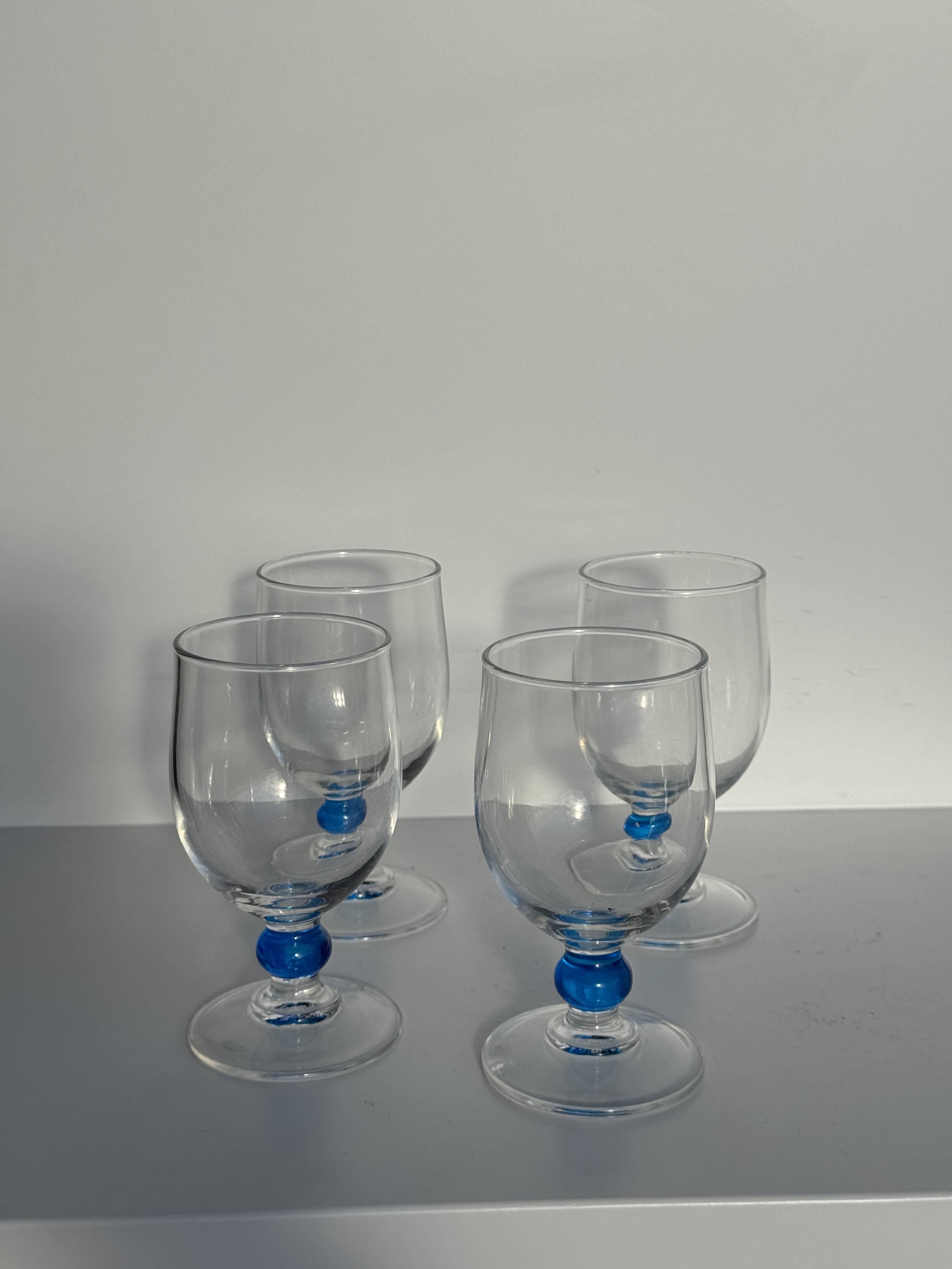 Set of 4 blue ball stemmed water glasses
