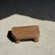Small stool, teak footrest with short cut corners.