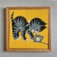 Wooden frame puzzle from the 1940s/50s depicting a cat on a yellow background.