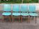 4 Scandinavian dining chairs in solid wood and blue-green leather from the 1950s.