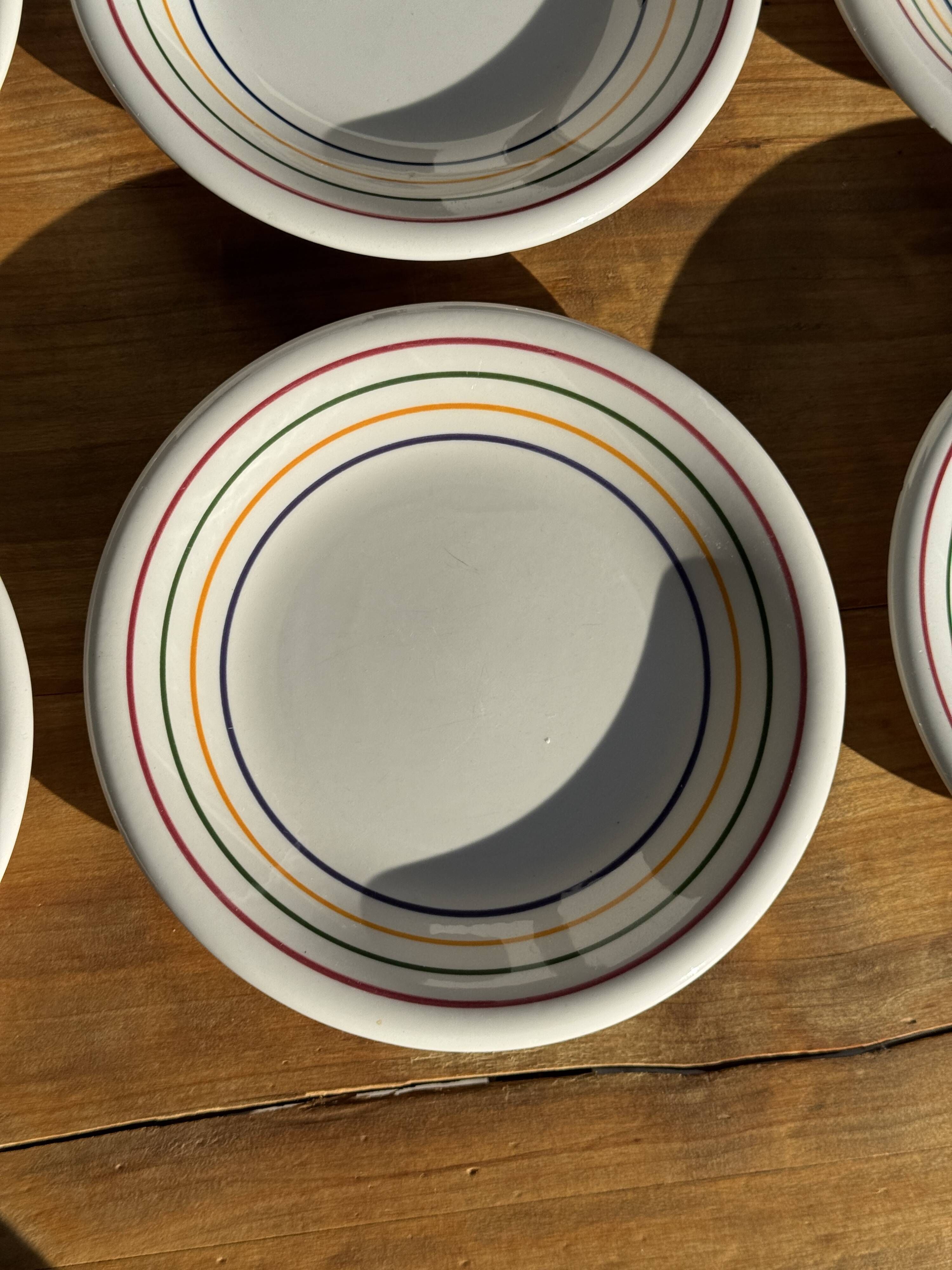 Set of 9 small Italian dessert plates Primula with red and green trim.