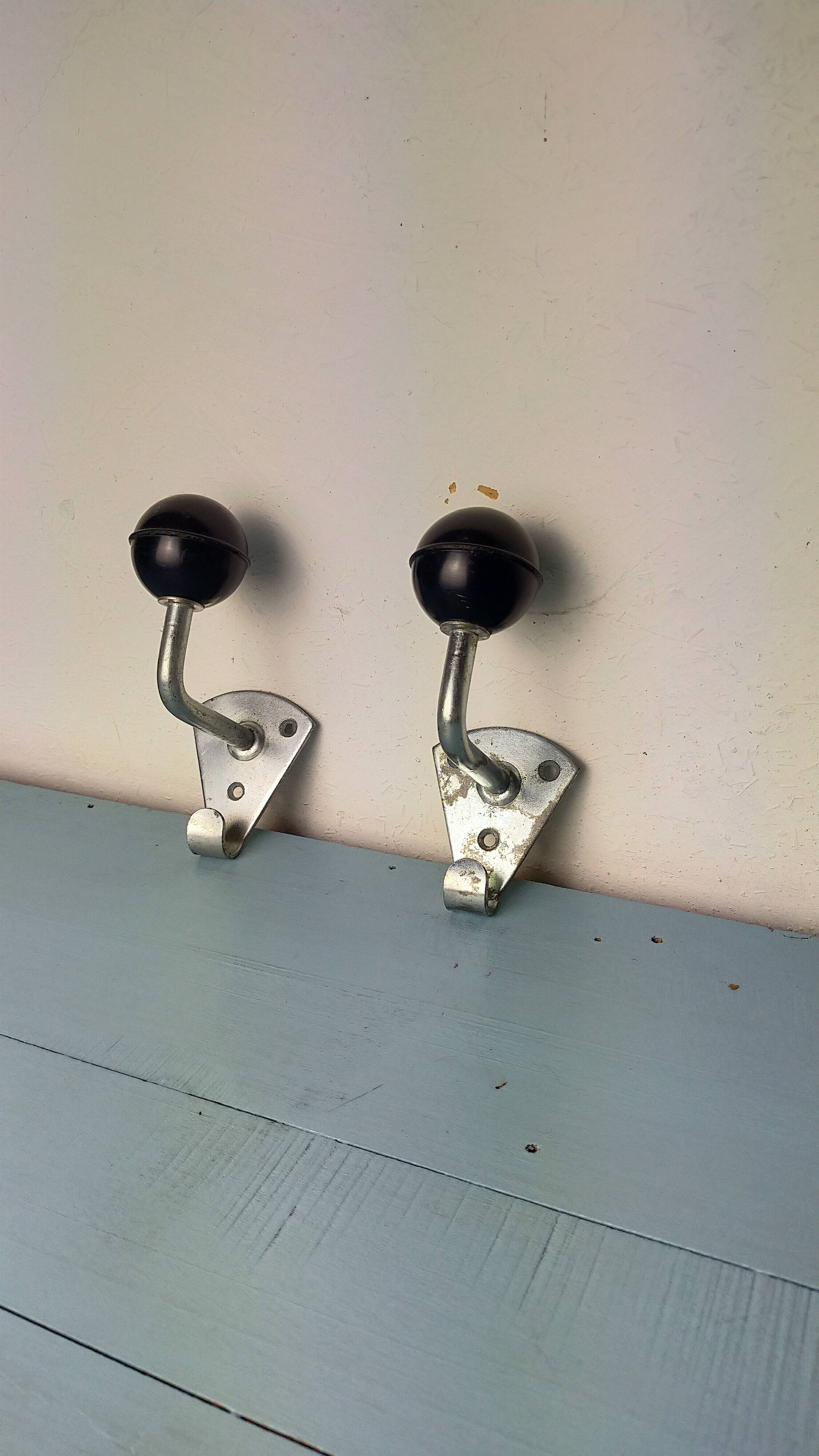 2 Bakelite ball coat hooks
