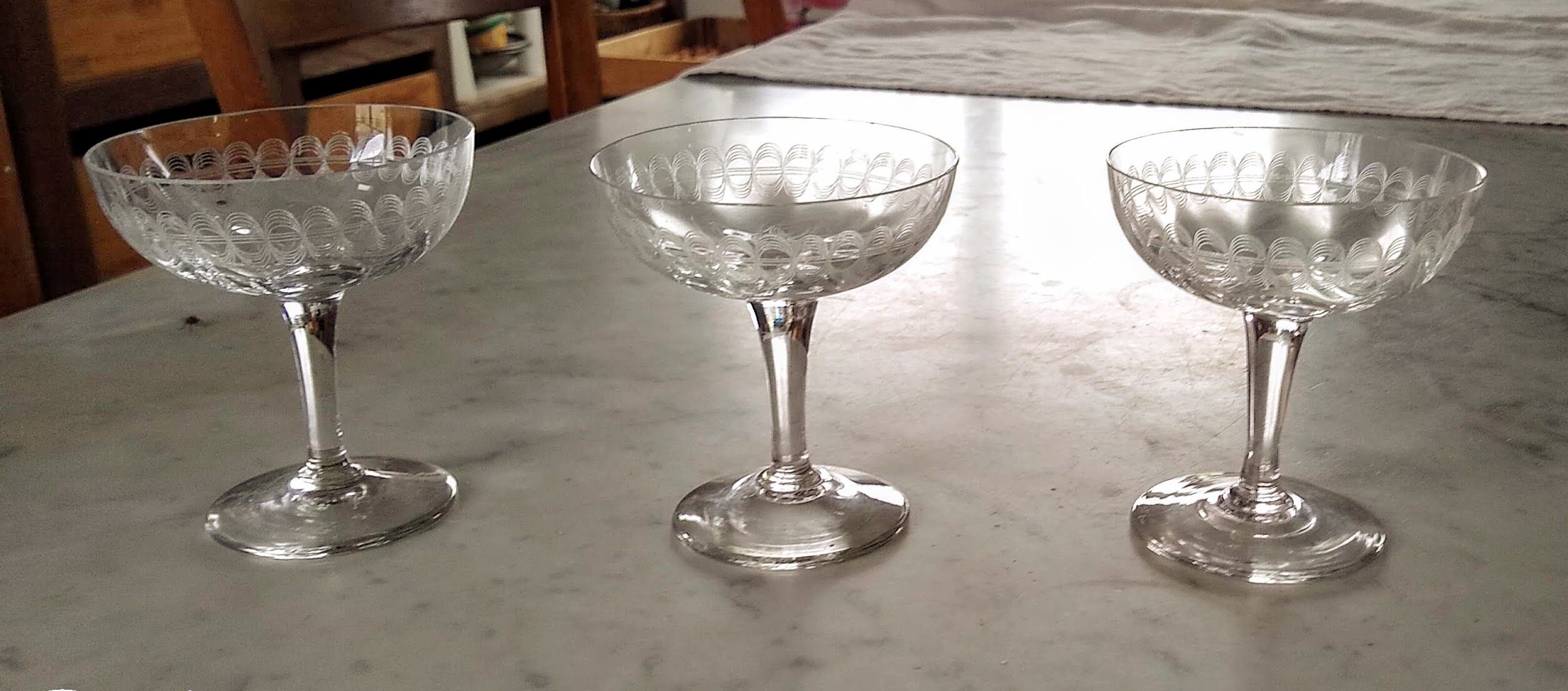 3 champagne glasses in cut glass