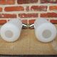 2 old wall lights in chrome and white glass.