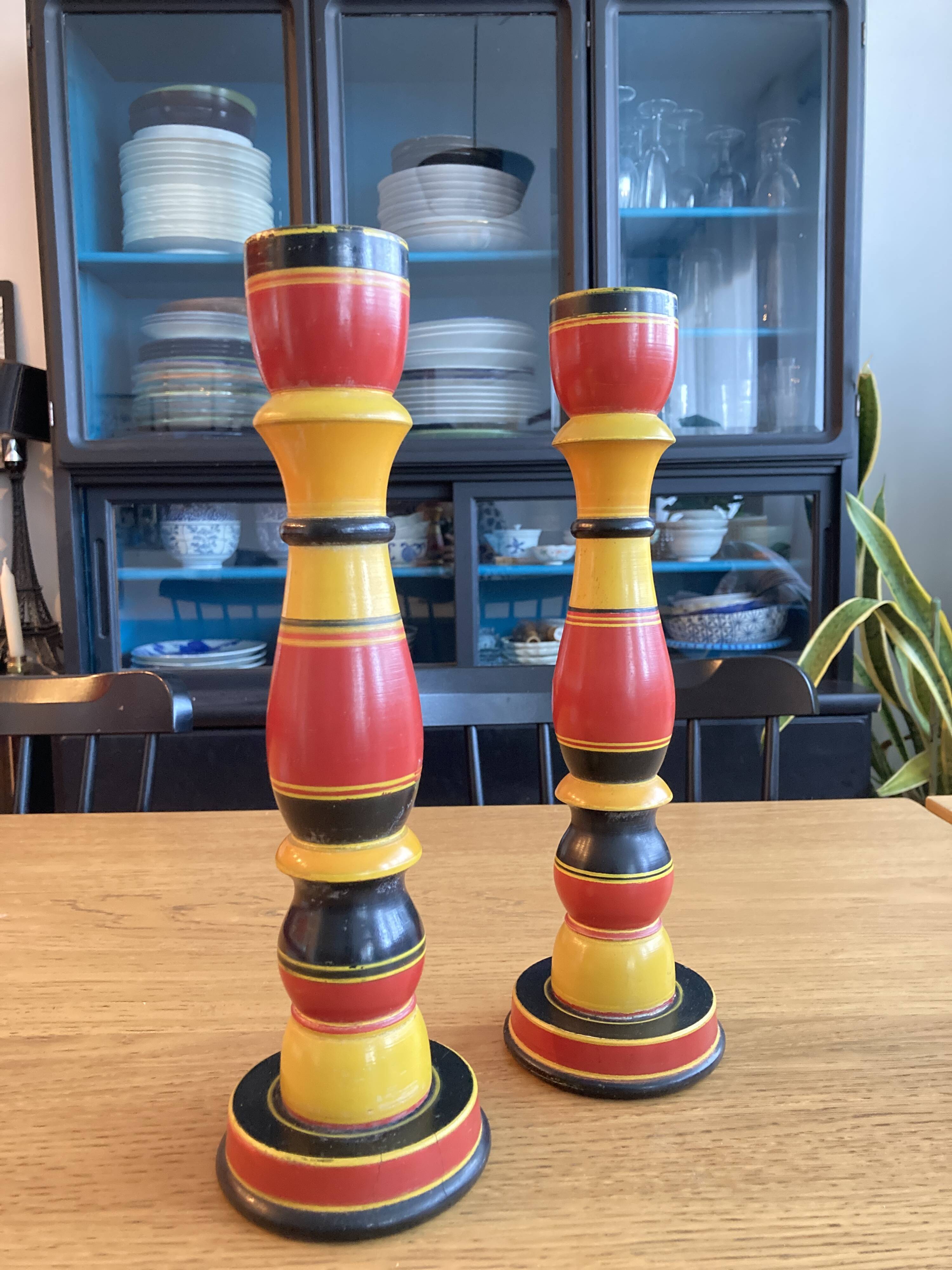 Polychrome turned wooden candlesticks
