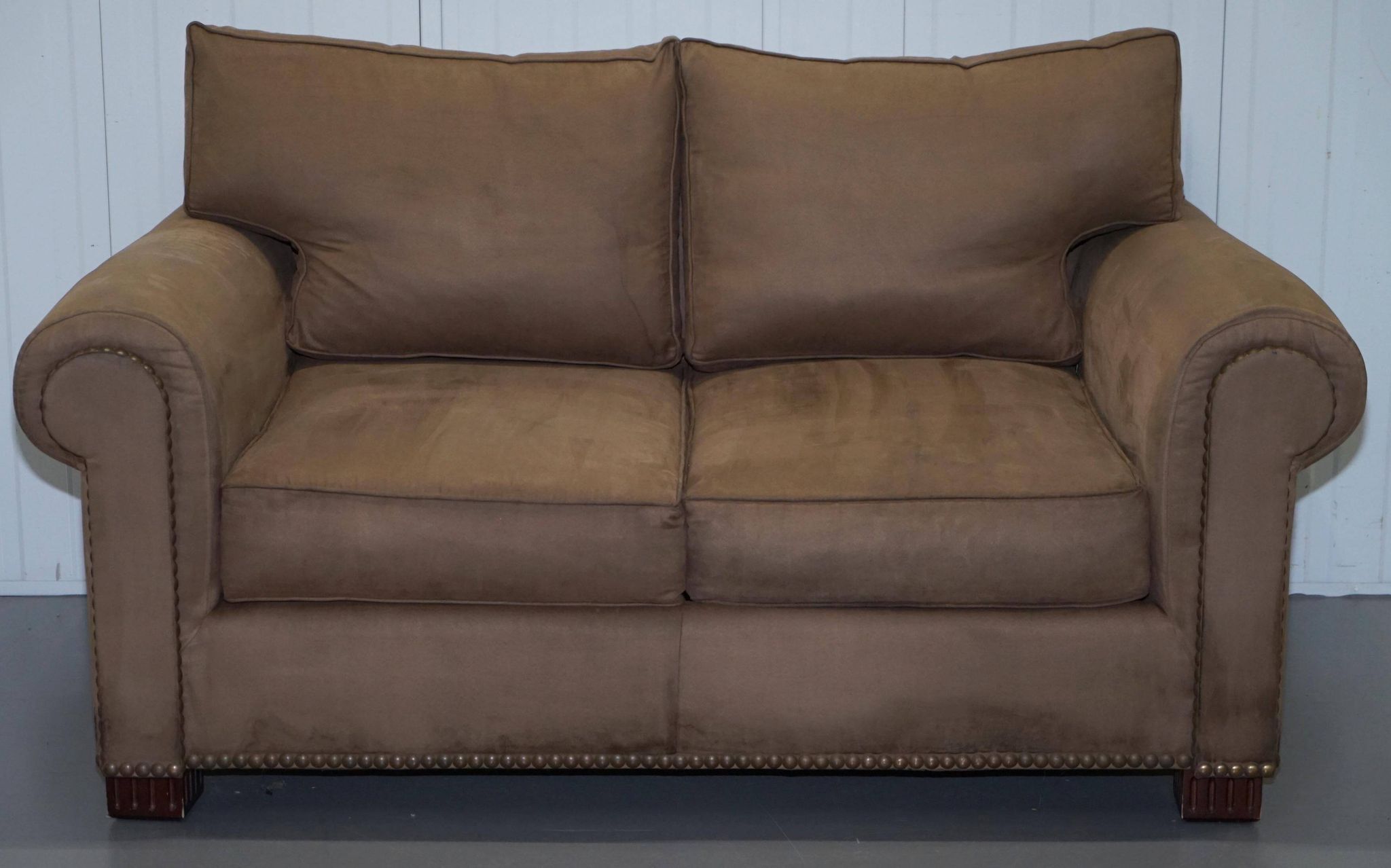 Ralph Lauren Jamaica velvet sofa pair with feather cushions.