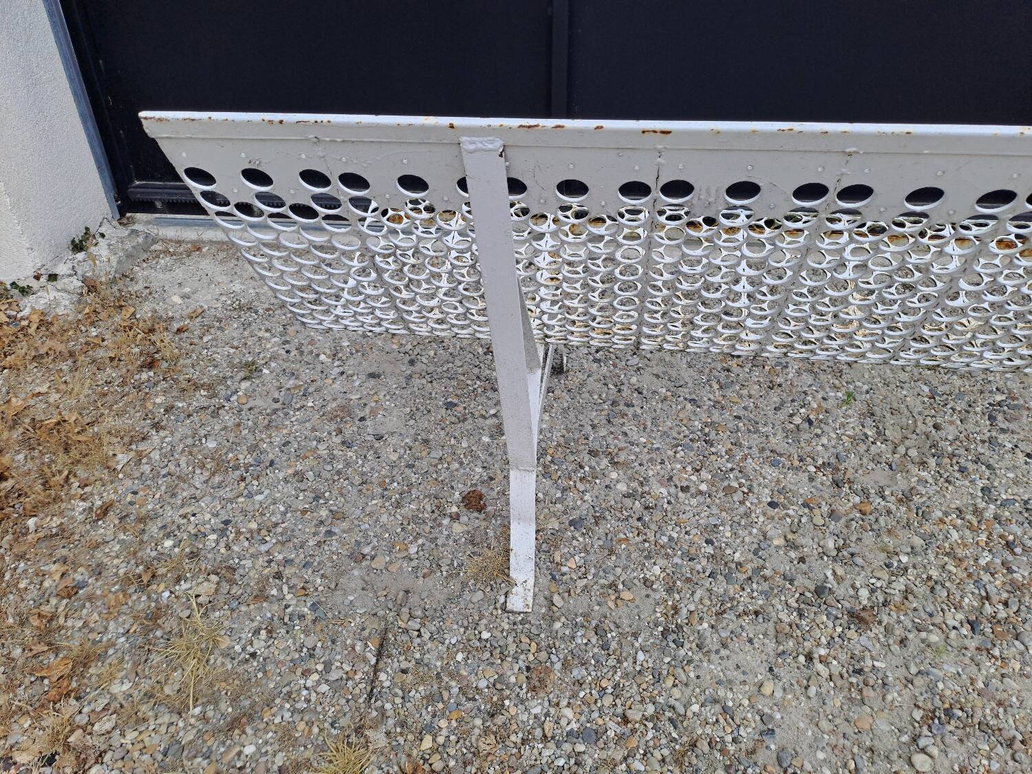 Garden bench in iron and perforated sheet metal