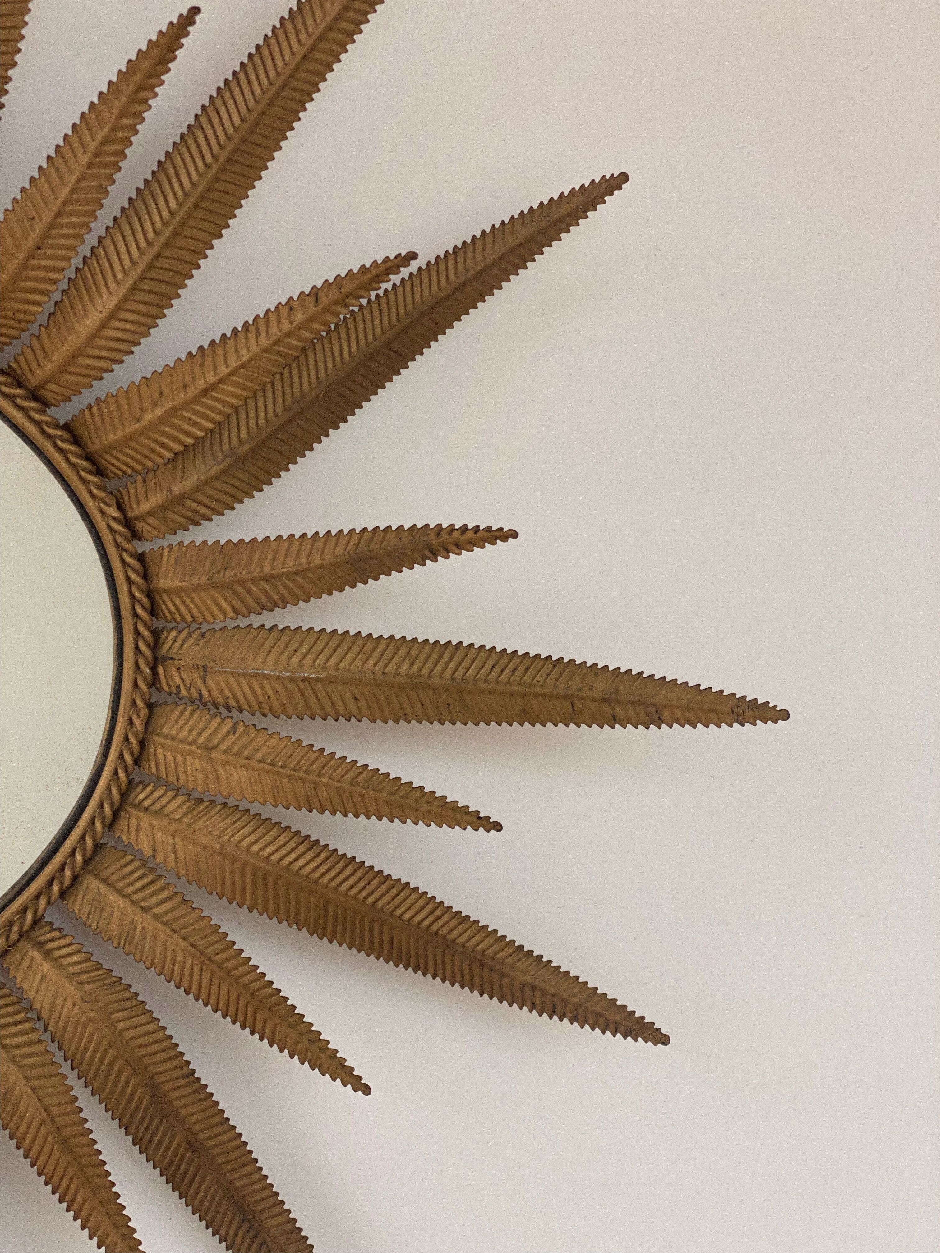 Vintage copper metal sun mirror oval shaped from the 1960s
