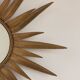 Vintage copper metal sun mirror oval shaped from the 1960s