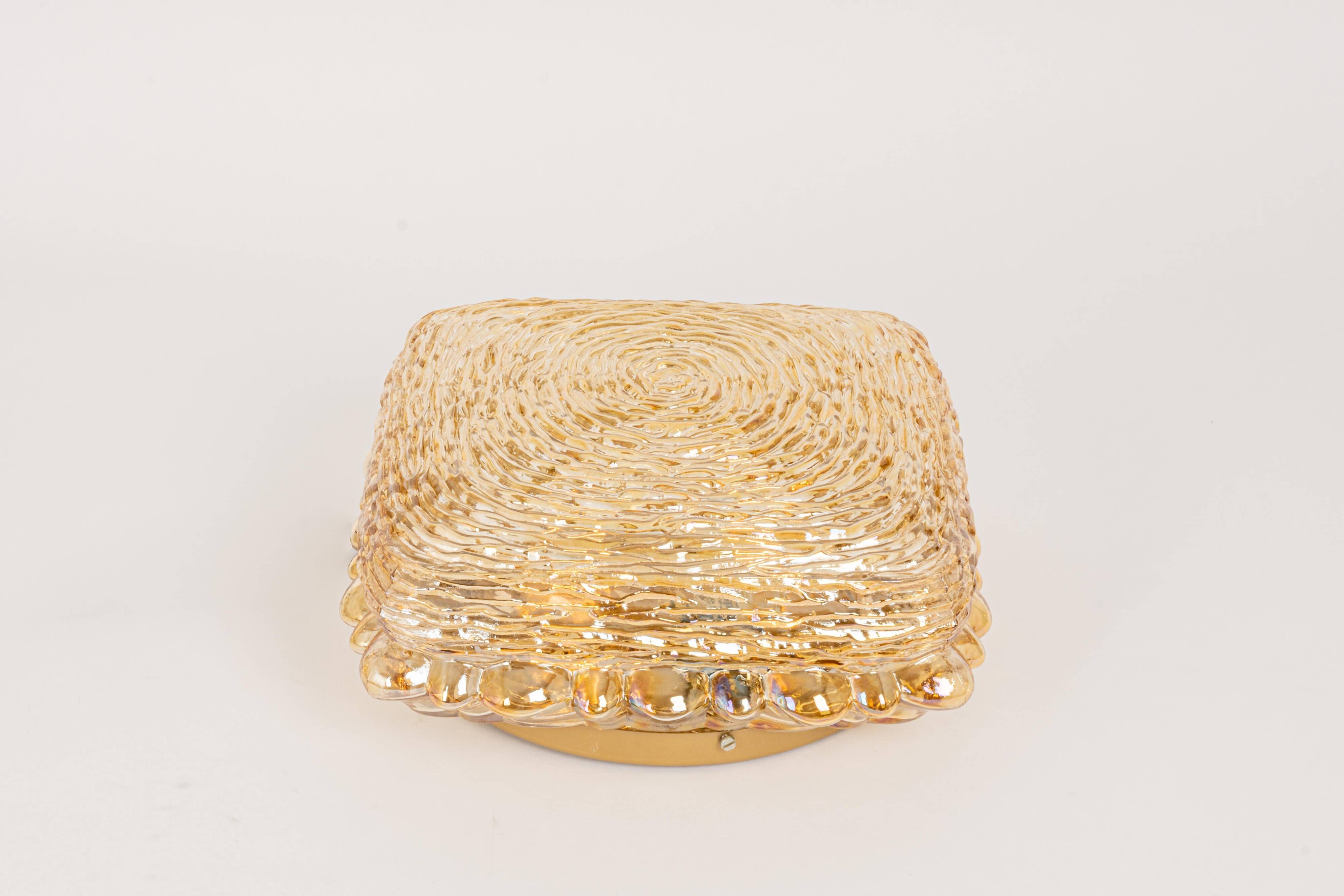 Amber glass wall light in the shape of a fingerprint, Germany, 1970s.