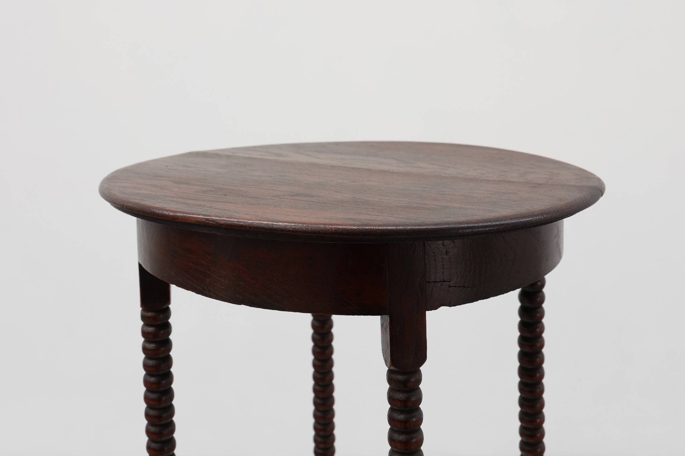 Art Deco round wooden side table with spindle legs, France circa 1900