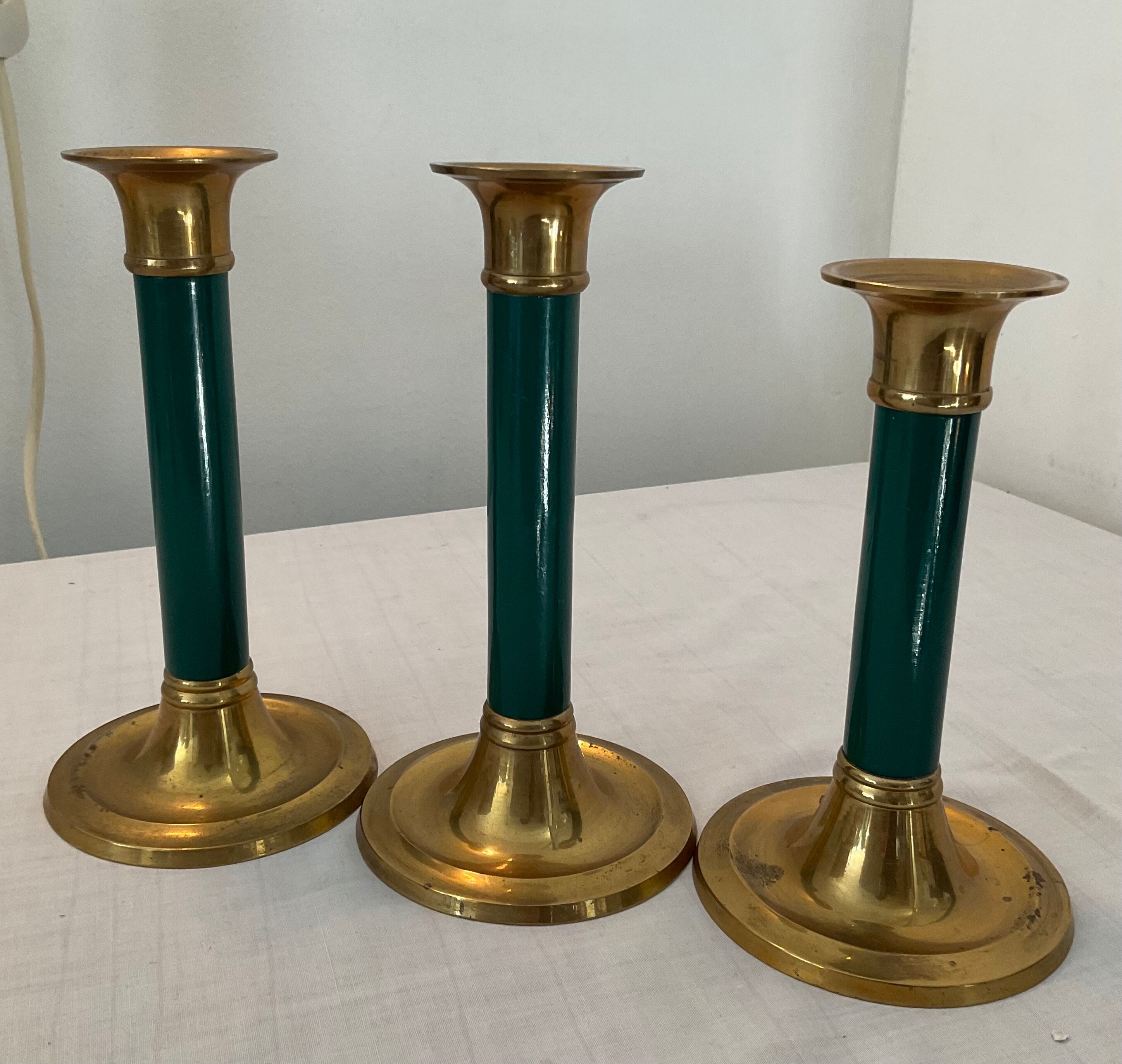Trio of vintage bronze candle holders