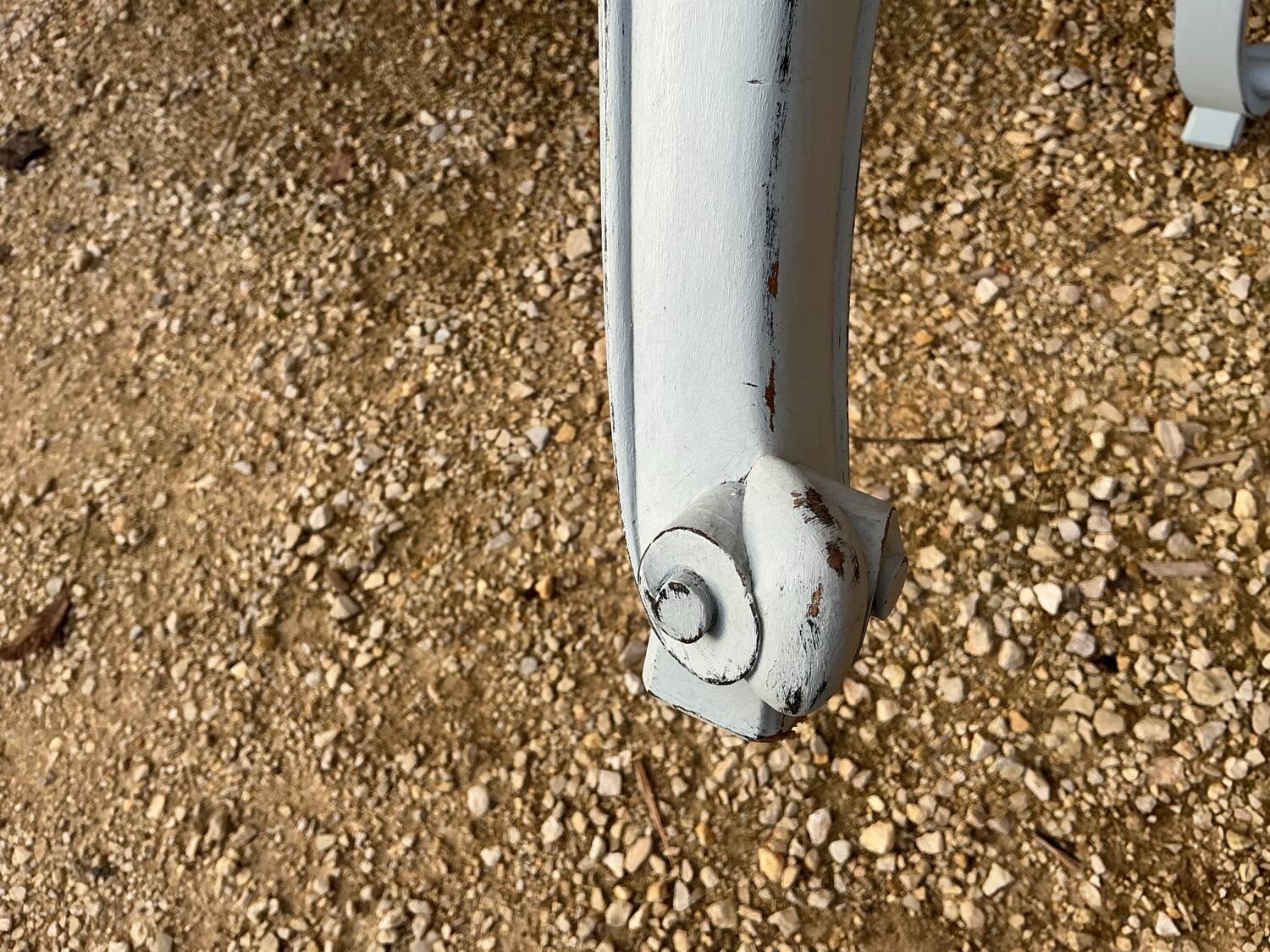 Louis XV style walnut table with a natural wood top.