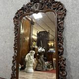 Very important Black Forest mirror in molded and carved wood