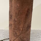 Large chamotte clay lamp in brutalist style, with a plant motif.