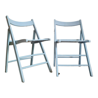 Pairs of folding wooden chairs in soft blue color