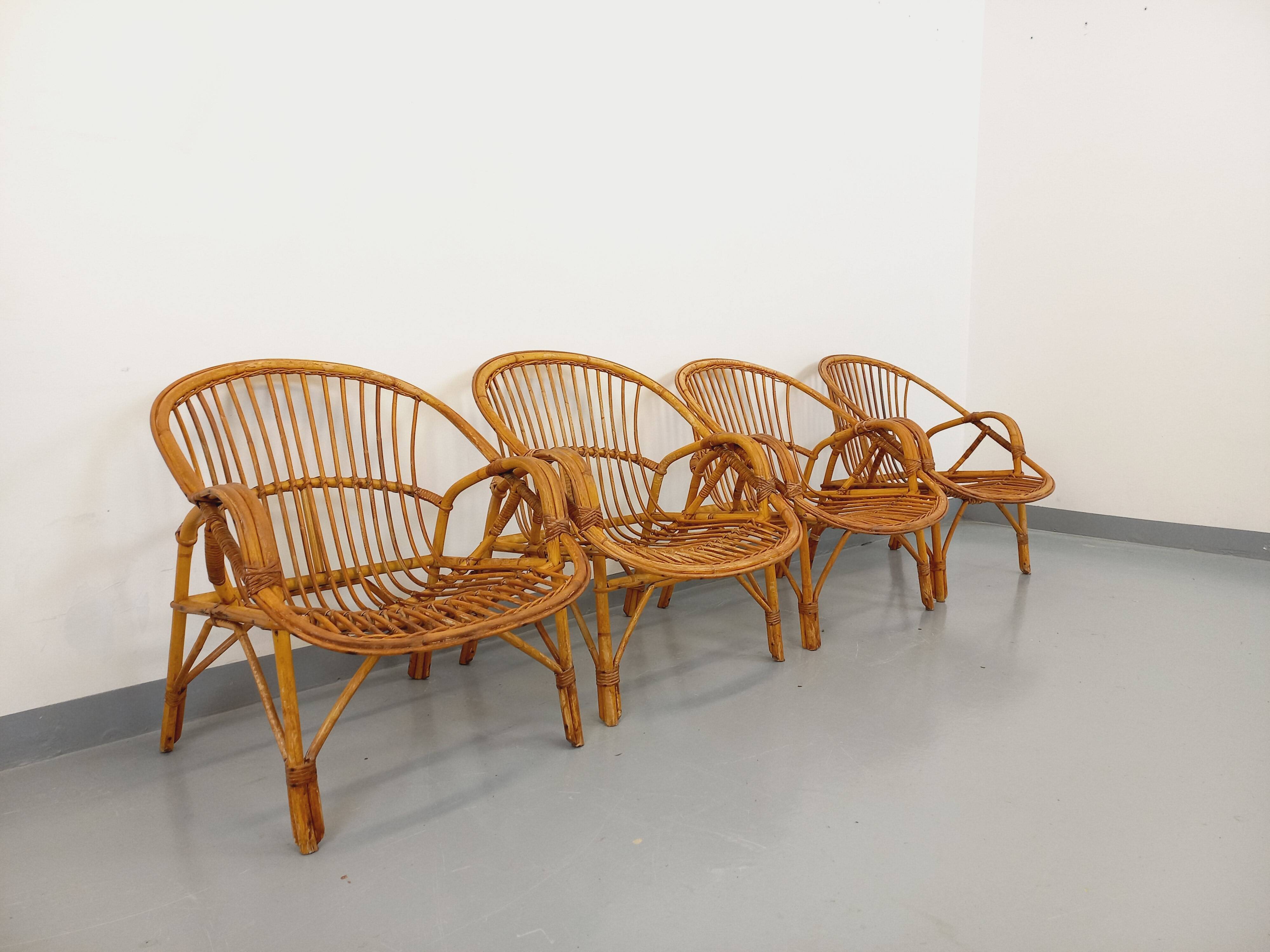 Set of 4 vintage rattan armchairs from the 60s