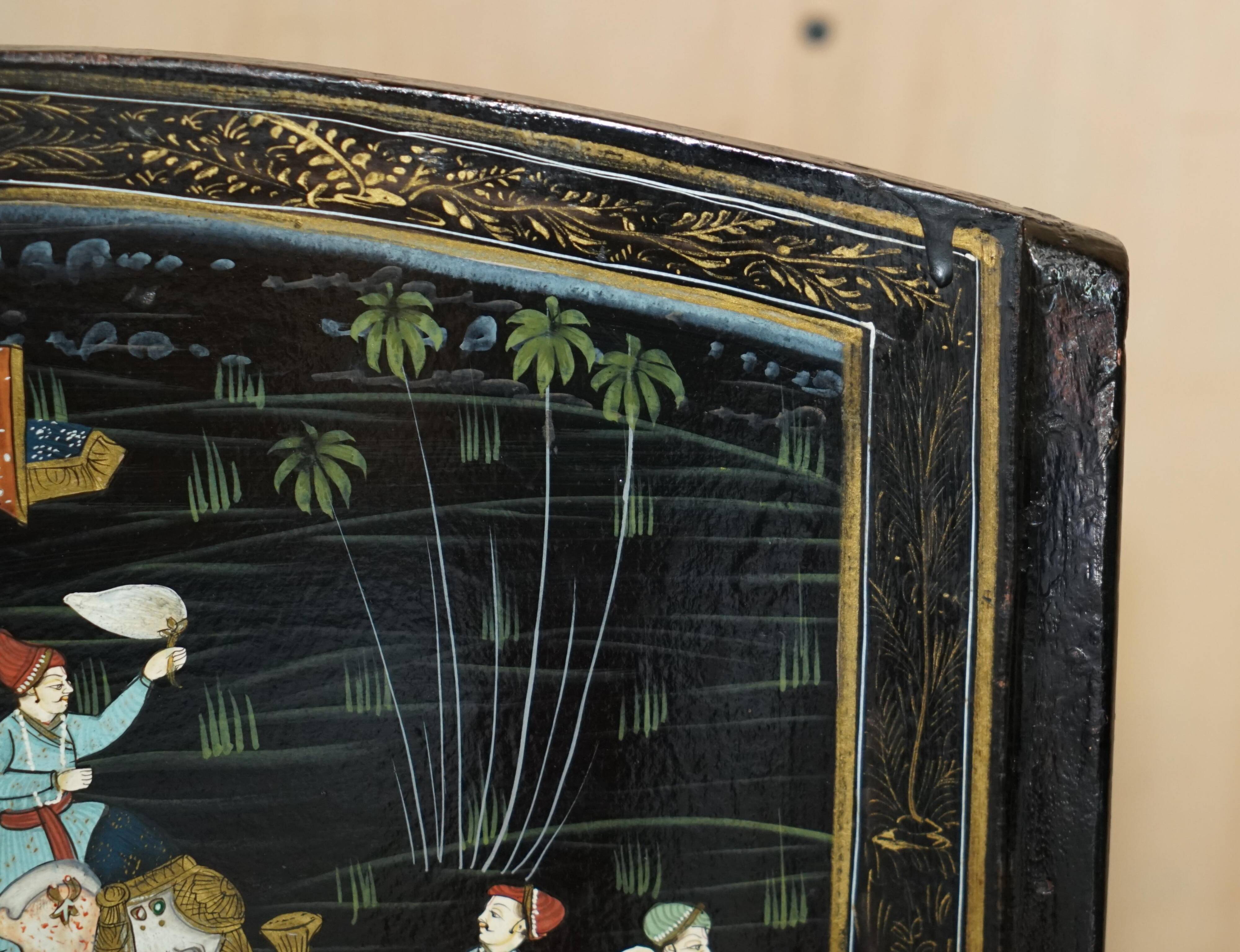 Pair of military folding chairs with Indian decoration.