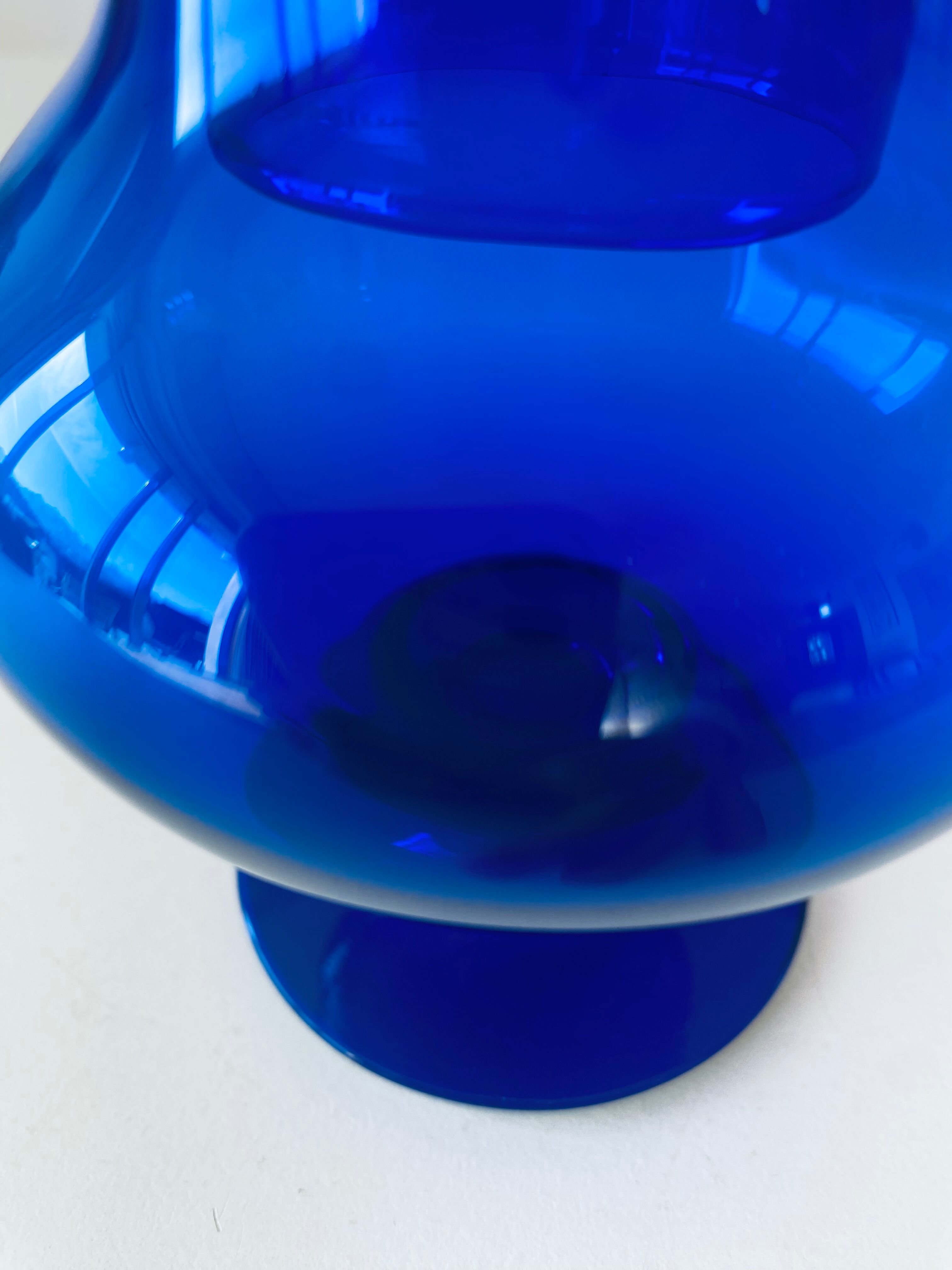 Blue glass apothecary shaped bottle