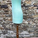 Old mannequin on wooden and fabric stand