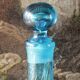 Large blown crystal bottle, twisted, turquoise blue, early 20th century.