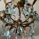 Antique Italian chandelier with cage and blue tassels