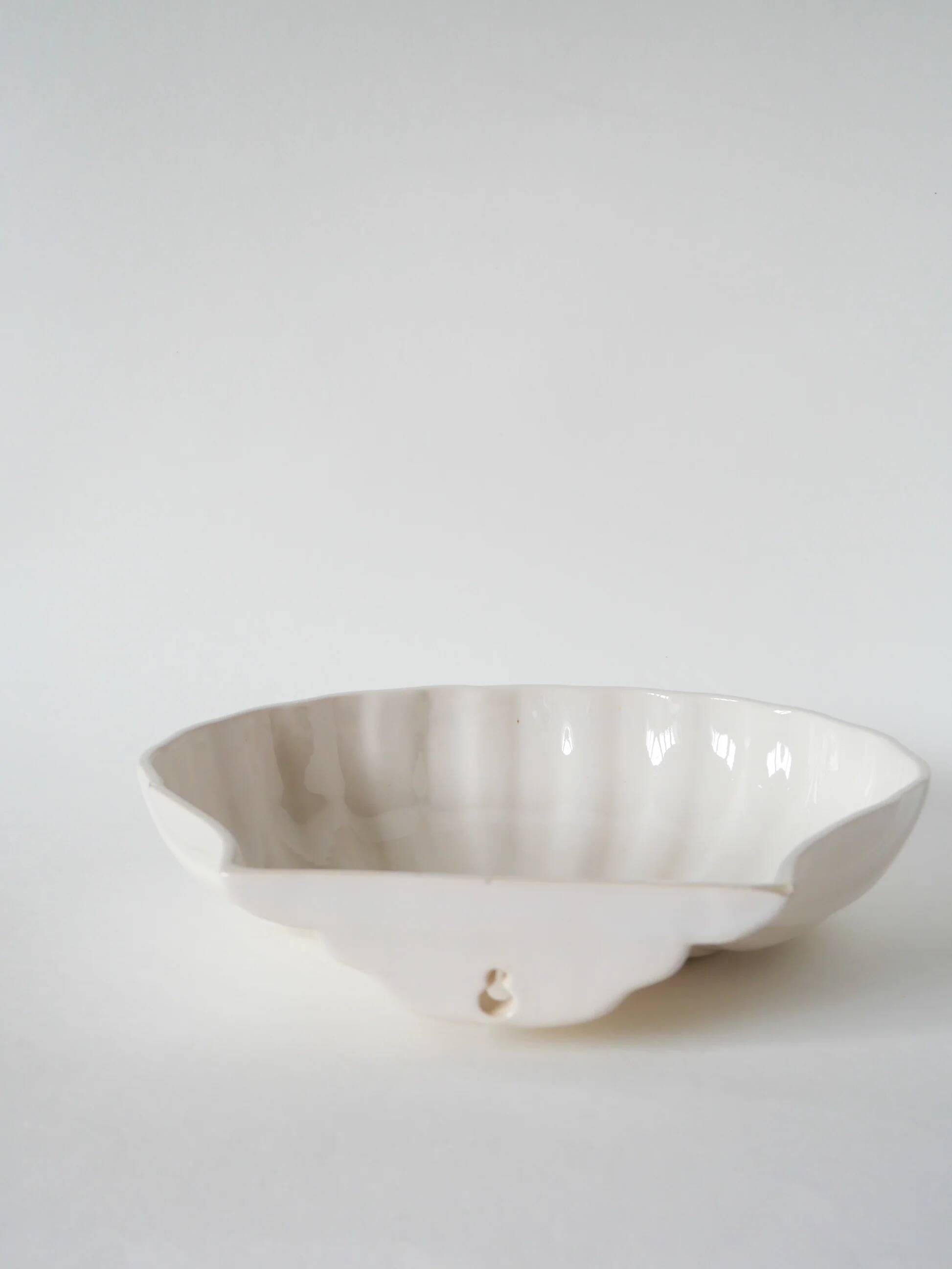 Large shell-shaped bowl to be placed or fixed, 1960.