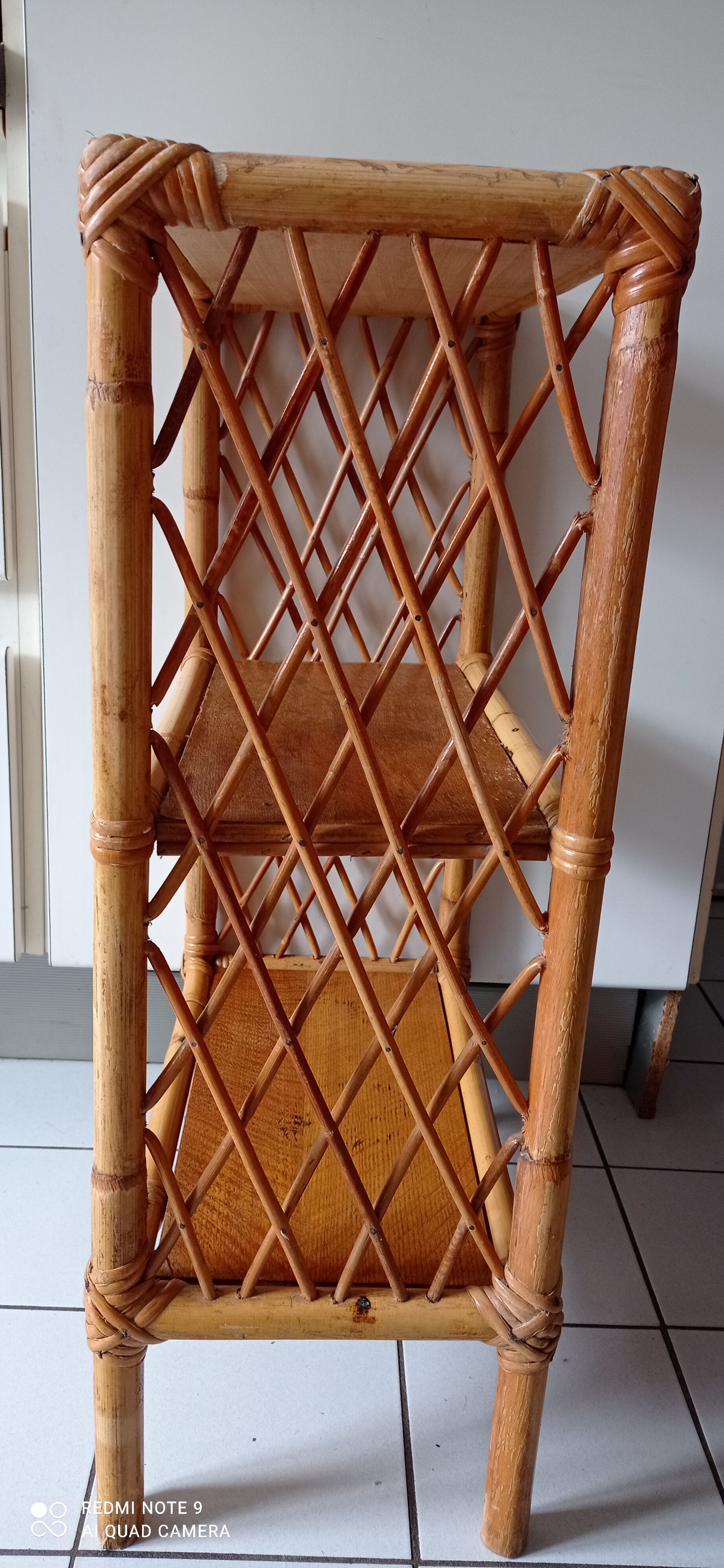 Old shelf on vintage rattan stands