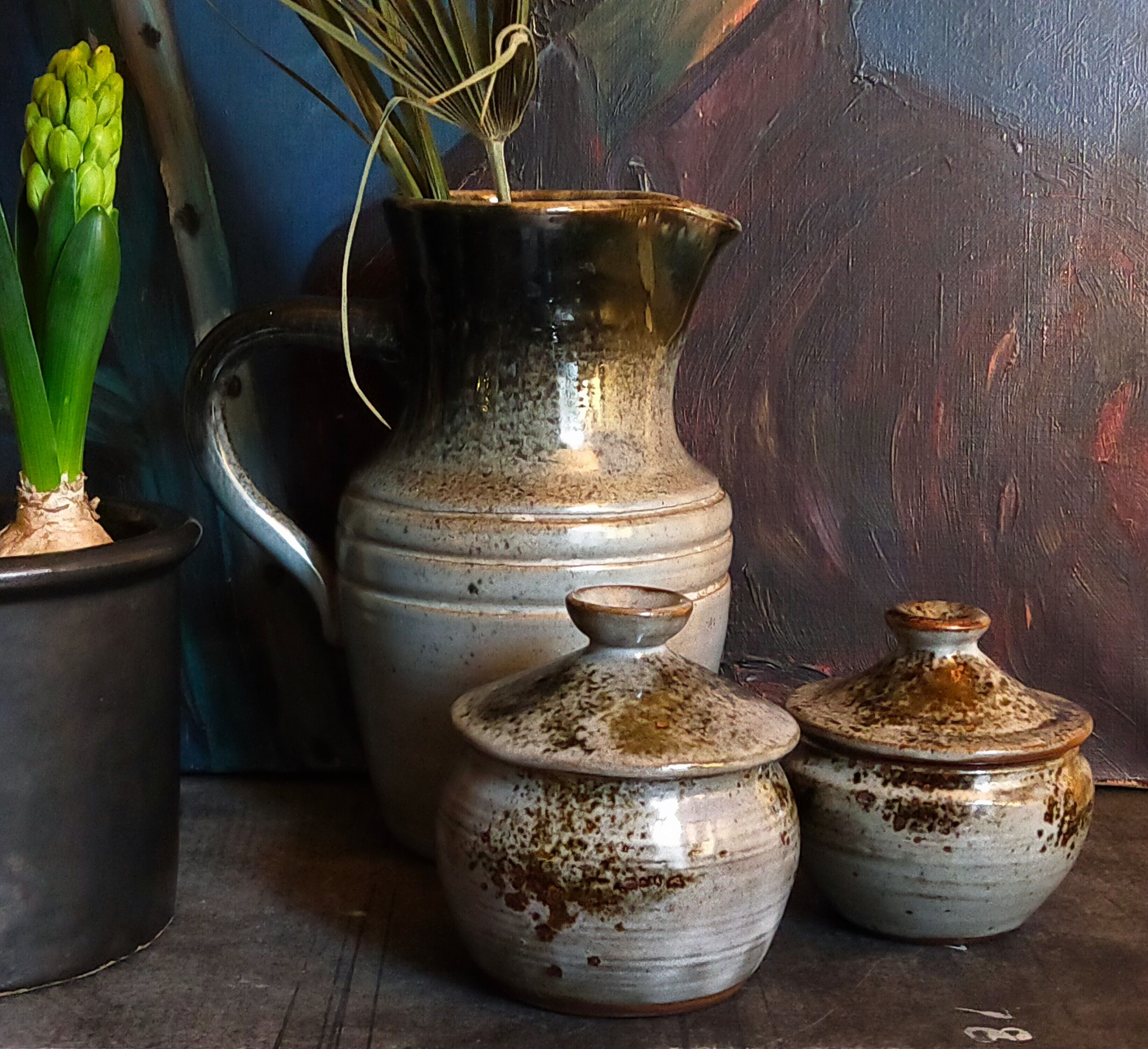Duo of potter's pots covered in vintage glazed stoneware