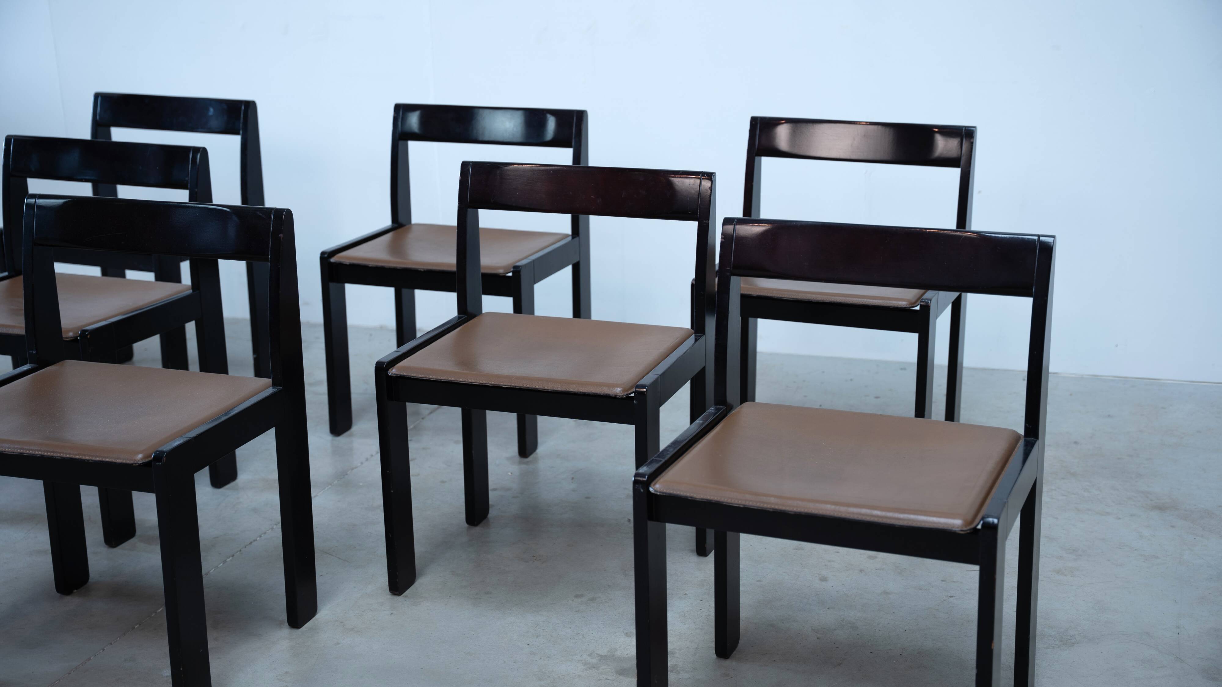 Set of eight black lacquered dining chairs