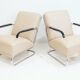 Pair of beige leather and tubular steel armchairs.