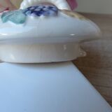 Old ceramic teapot in the shape of a basket of fruits from the garden