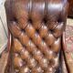 Rocking-chair Chesterfileld en cuir