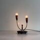 Simple double-headed table lamp in wood and brass, 1960s, Germany.