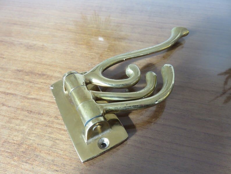 70s brass swivel coat door