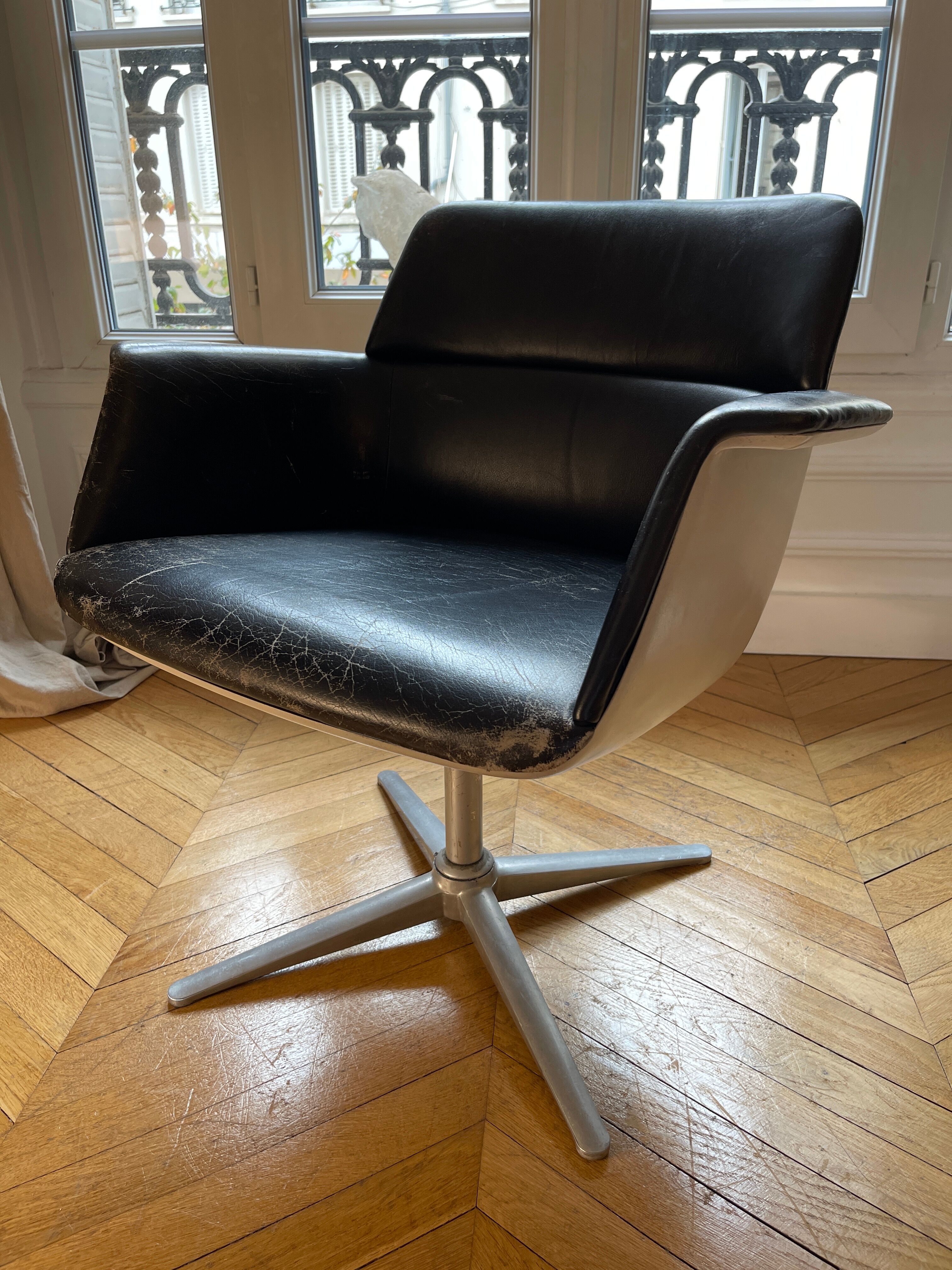 Swivel leather armchair