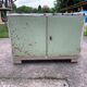 Vintage low wooden cabinet painted green and white with a floral fabric top (1950s)