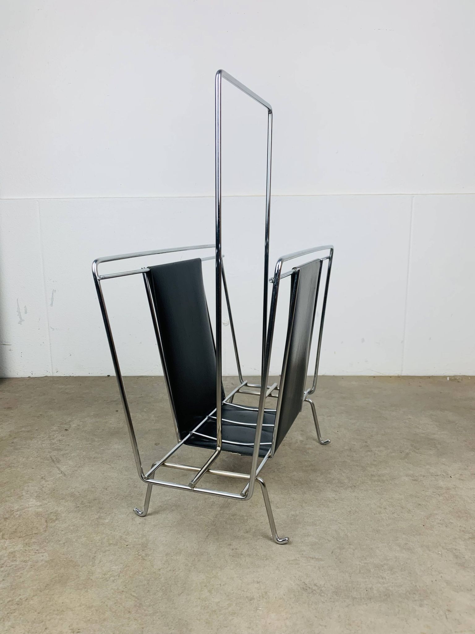 Chrome and black leather magazine rack, 1970s.