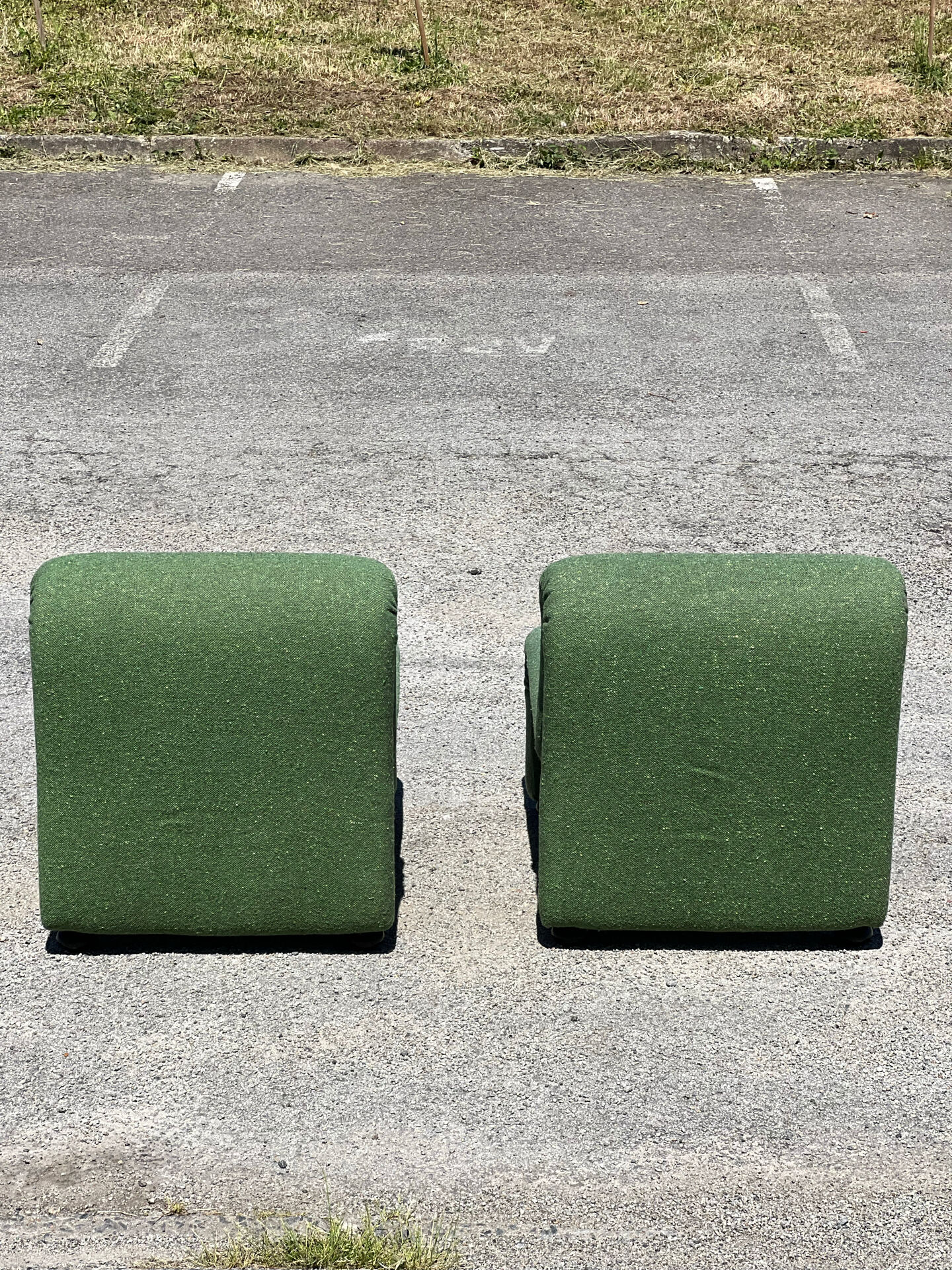 Green armchairs designed by Étienne Fermigier