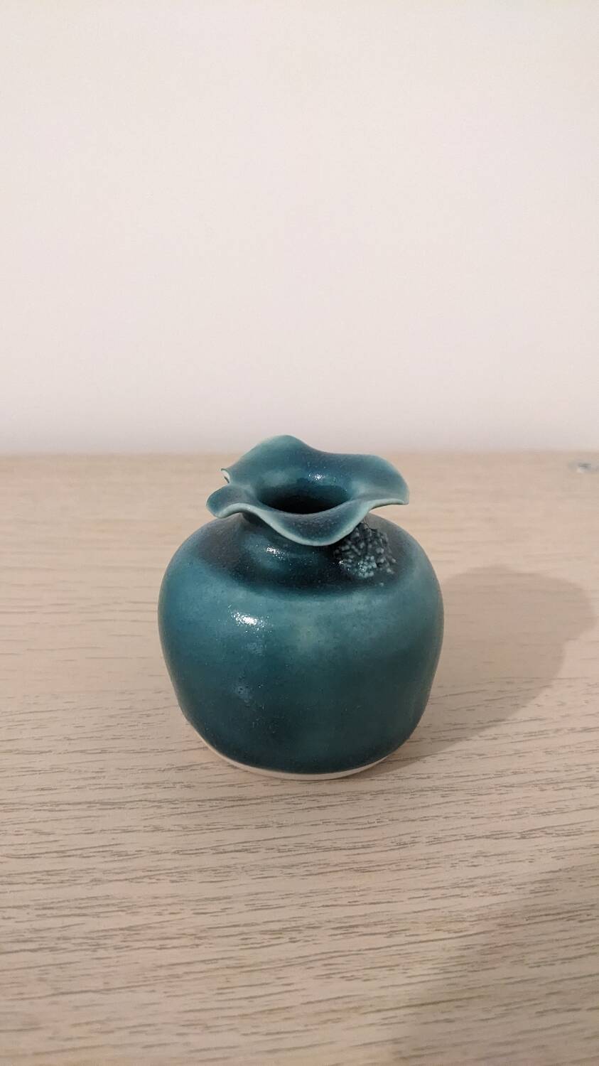 Small handmade turquoise pottery.