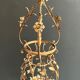 Important golden iron lantern with foliage decorations from the Baguès house.