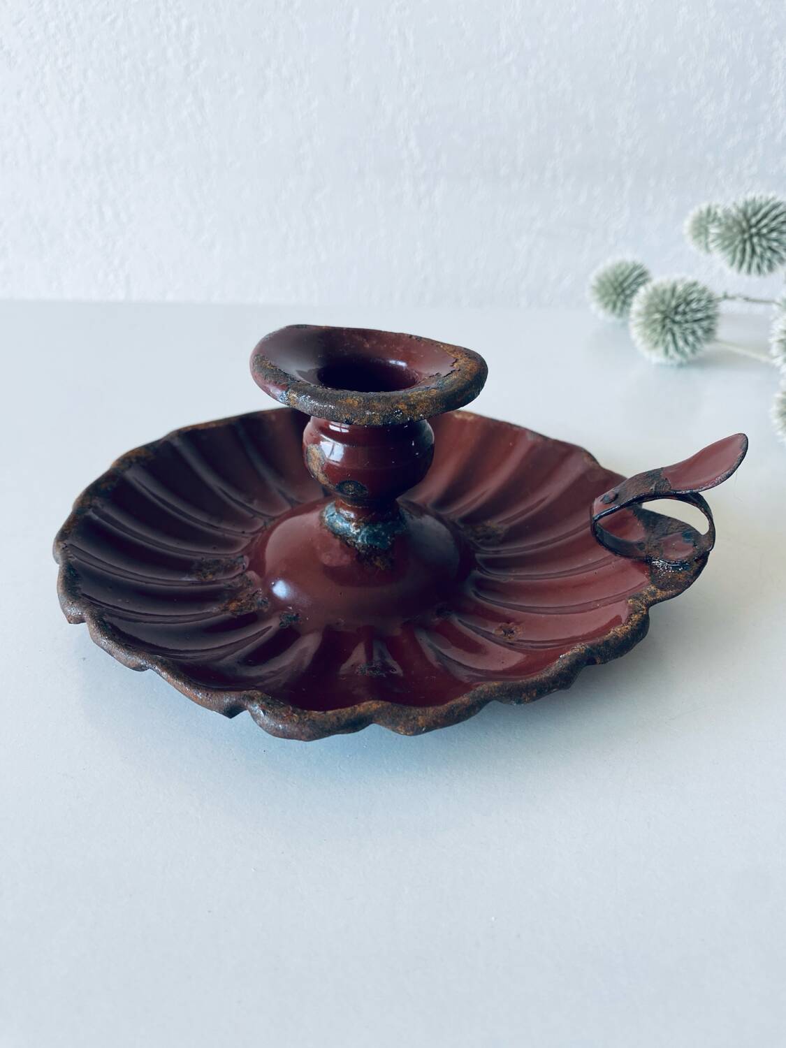 Antique enamelled candle holder