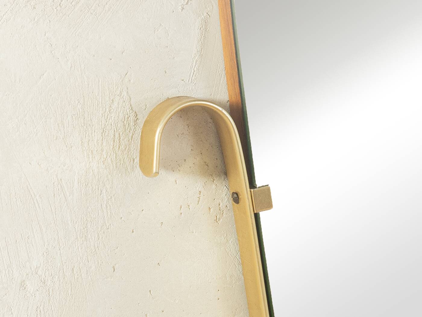 Elegant wall mirror from the 1950s with brass frame